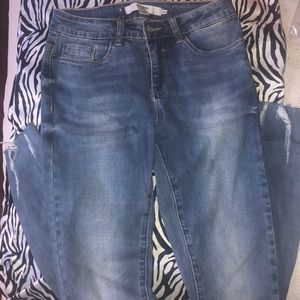 skinny jeans slightly ripped at bottom